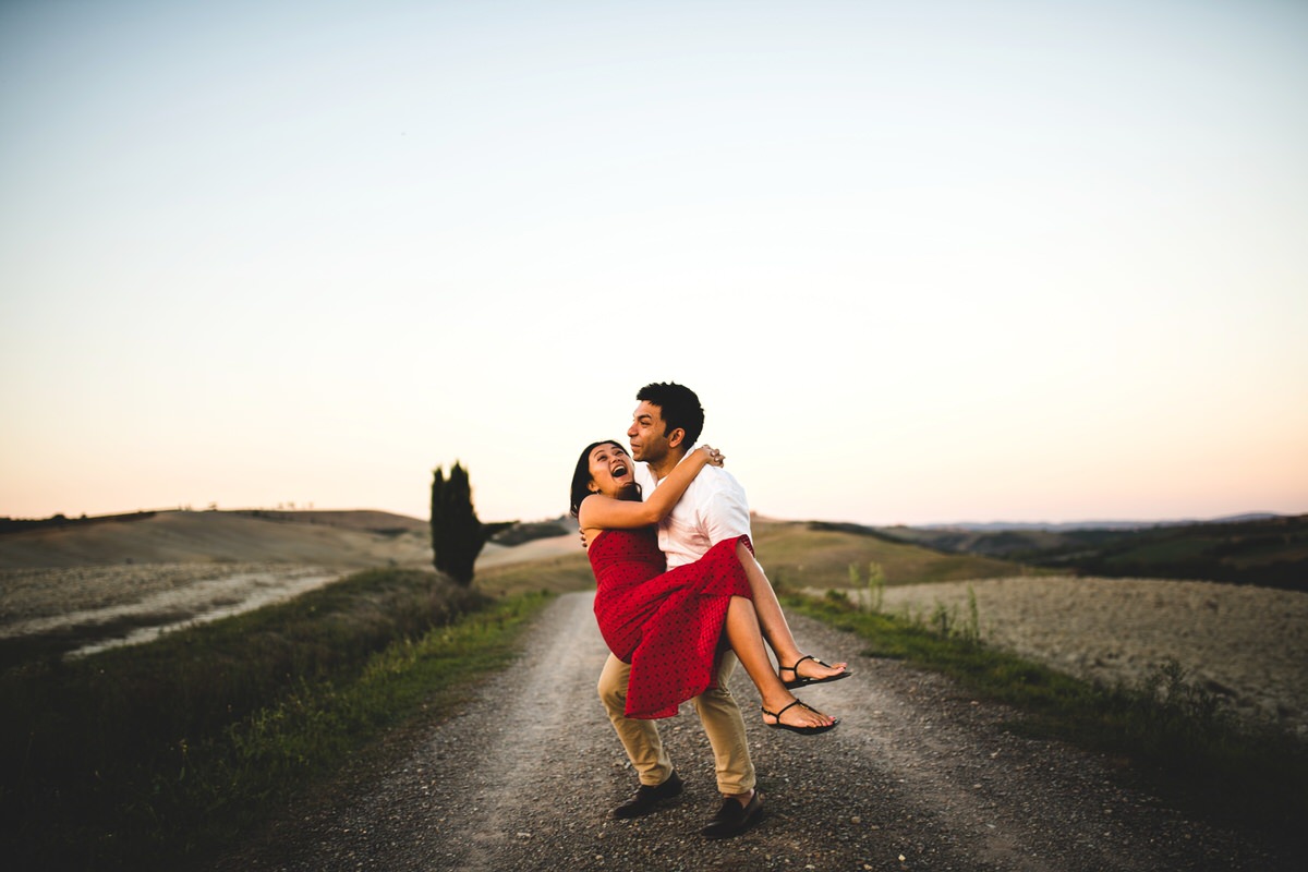 candid engagement photos in val d'orcia